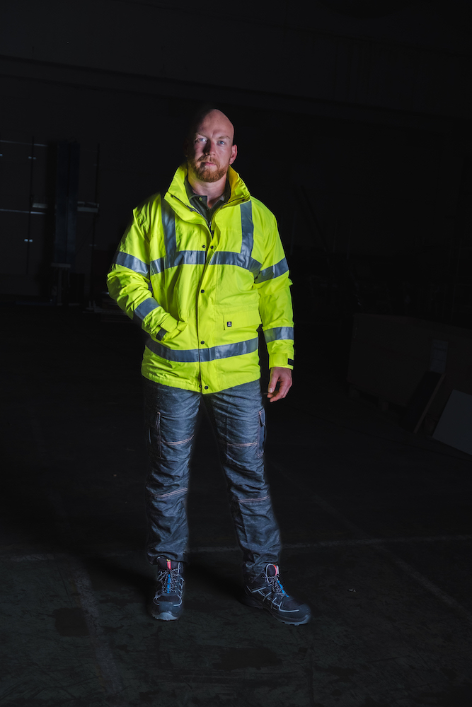 Man wearing cut resistant trousers with yellow Hi-Vis jacket from PPE Factory- photography by Broodkruimel_Creations